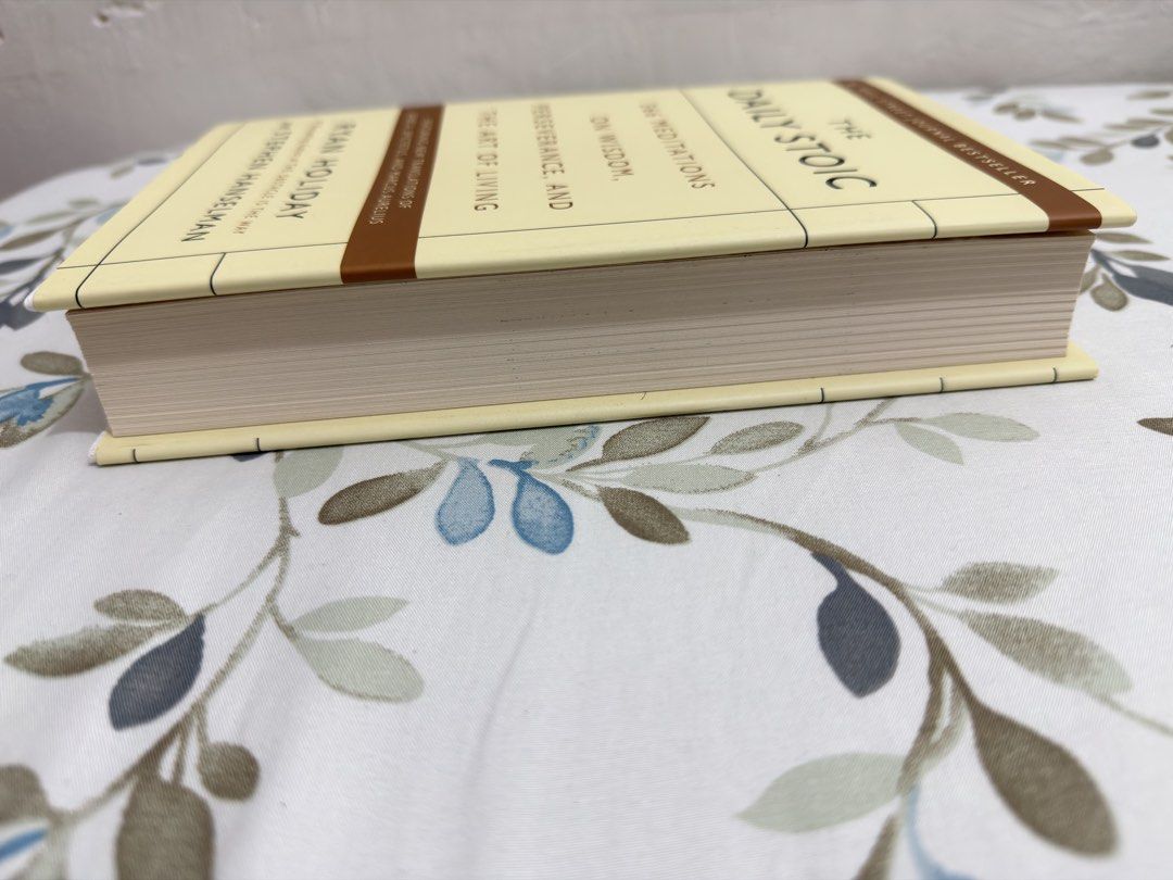 The Daily Stoic by Ryan Holiday (Category: Storybooks) located in Manila. Submitted by fayeshopacc (Listing ID 1432156173, Image 2). Description: - The Daily Stoic by Ryan Holiday and Stephen Hanselman. - Features 366 meditations. - Focuses on wisdom, perseverance, and the art of living. - Includes new translations of Seneca, Epictetus, and Marcus Aurelius. - Comes with a ribbon bookmark. - Pages are clean and the spine is intact..