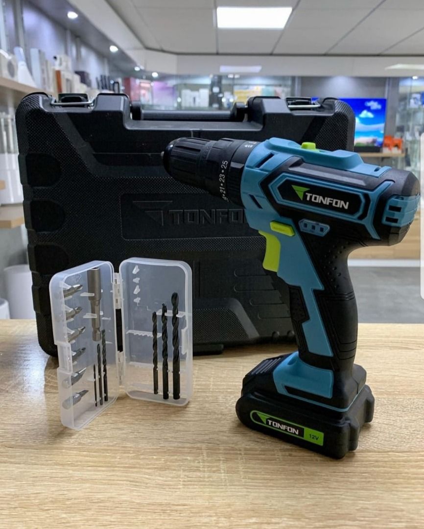 Tonfon 12V Cordless Drill with Accessories (Category: Construction Tools & Equipment) located in Caloocan City. Submitted by truehawk.889b68 (Listing ID 1432031363, Image 1). Description: - Tonfon 12V Cordless Drill - Includes drill bits and screwdriver bits - Adjustable torque settings - Forward/Reverse switch - Stylish teal and black design - Green power button - Comes with a carrying case - Battery included.