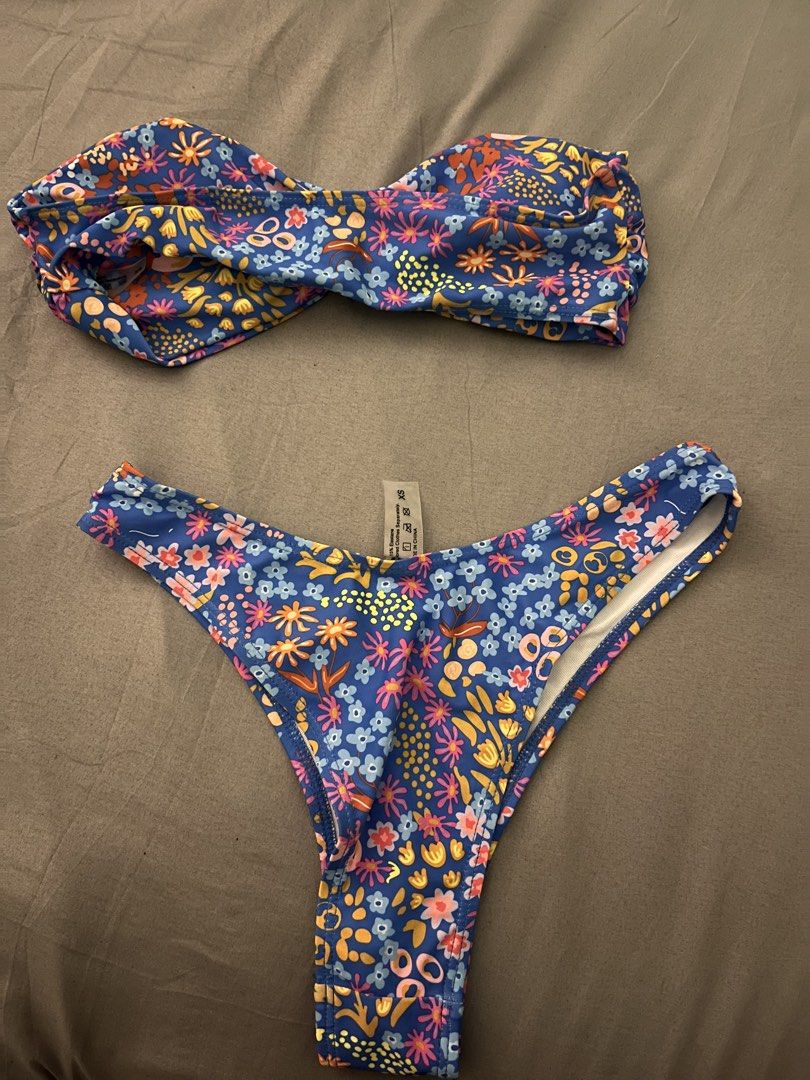 Tube Blue Floral Print Bikini Set (Category: Bikinis & Swimsuits) located in Calamba. Submitted by natalierav (Listing ID 1432100364, Image 2). Description: - Floral print bikini set - Bandeau top with twist detail - High-cut bottoms - Made of stretchy material - Perfect for beach or pool USED ONCE.