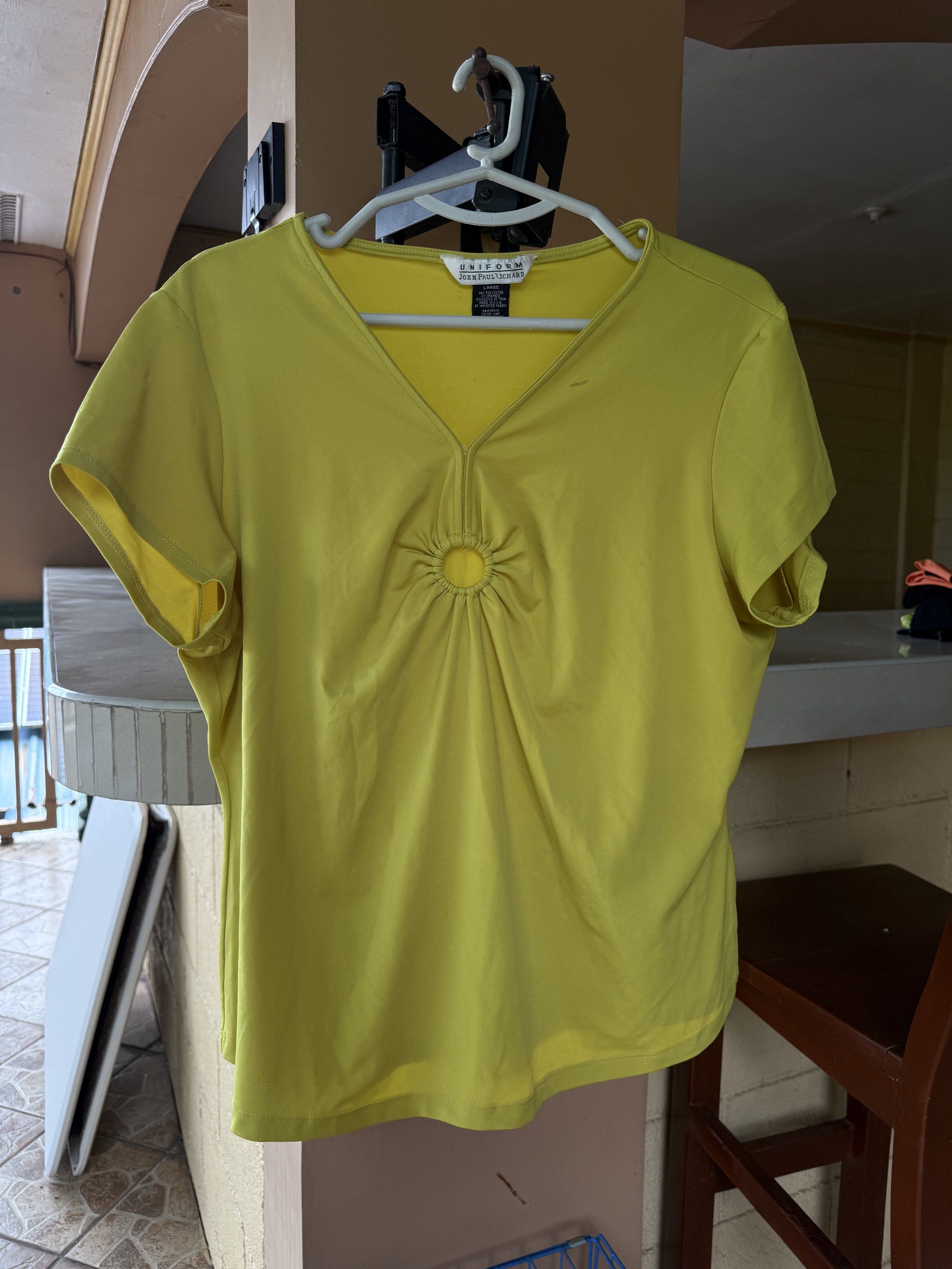 Uniform V-Neck Top (Category: Blouses) located in Balanga. Submitted by julierms (Listing ID 1432054396, Image 1). Description: - Brand: Uniform - Style: V-neck top - Color: Yellow - Detail: Ring accent - Sleeves: Short.
