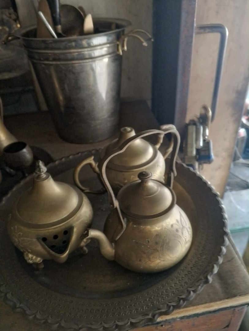 Vintage Brass Tea Set (Category: Coffee & Tea Tableware) located in Mabalacat. Submitted by darkmochafrappe2 (Listing ID 1432041542, Image 1). Description: - Vintage brass tea set - Includes teapot, sugar bowl, and serving tray - Teapot with curved spout and handle - Sugar bowl with lid - Serving tray with decorative edge.
