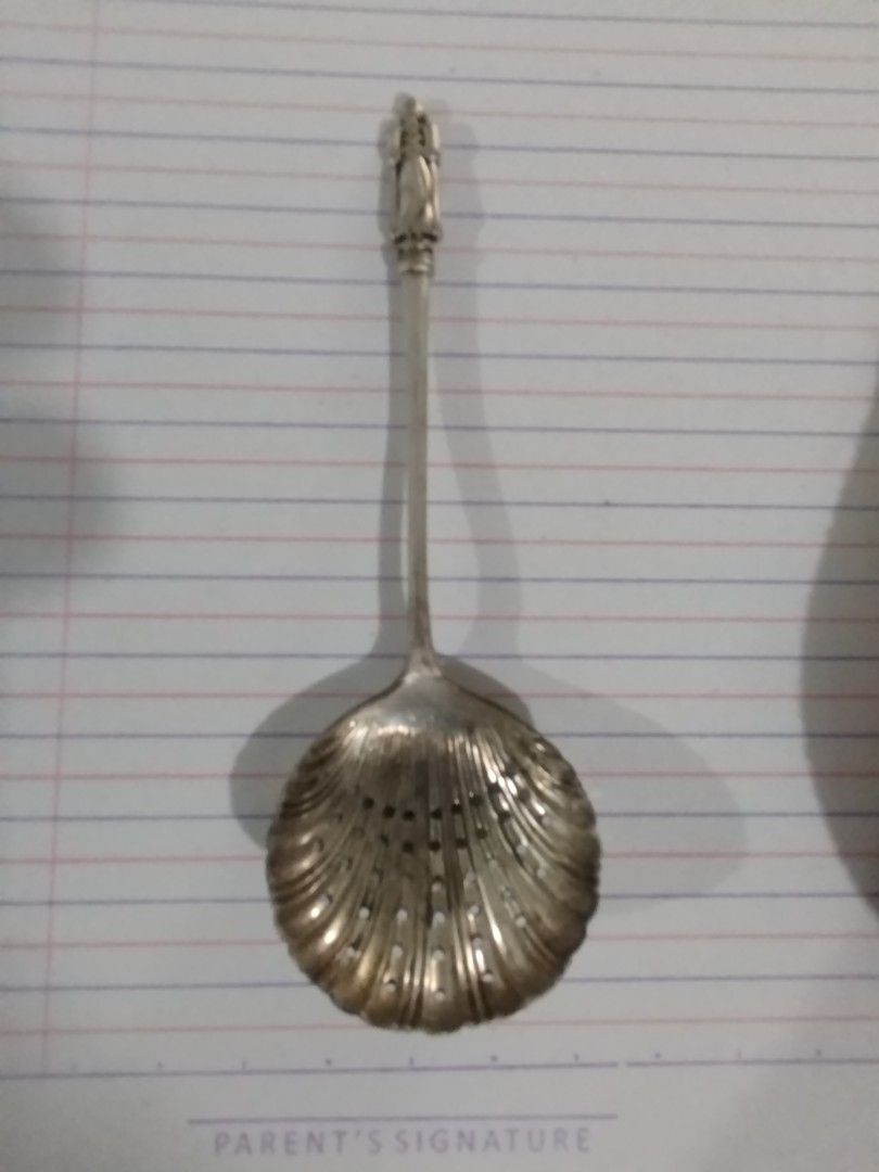 Vintage Victorian Silver plated apostle Spoon (Category: Dinnerware & Cutlery) located in Subic. Submitted by regiedaniel01 (Listing ID 1432034557, Image 2). Description: - Vintage silver spoon - Features a figurine on the handle - Shell-shaped bowl with holes - Intricate details - Decorative piece - Made of silver 15.8 grams.