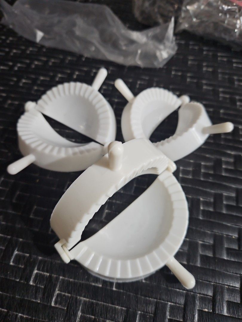 White Dumpling Maker (Category: Bakeware) located in Manila. Submitted by just_about_anything (Listing ID 1432127208, Image 2). Description: - Easy dumpling making set - Made of durable white plastic - Includes multiple pieces for efficient use - Features a convenient handle - Creates dumplings with a crimped edge for perfect sealing.