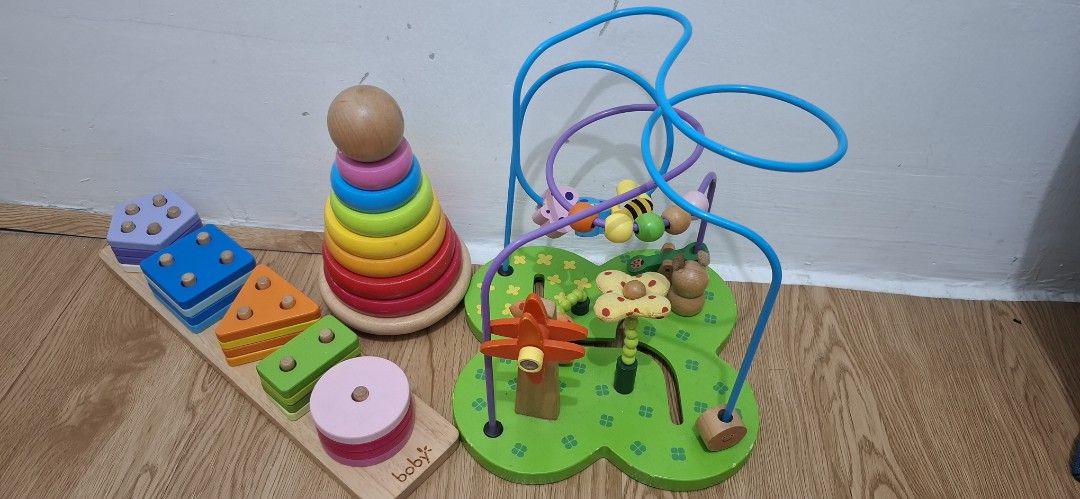 Wooden Shape Sorter and Bead Maze (Category: Educational & Learning Toys) located in Cavite. Submitted by saydiecam32222 (Listing ID 1432142622, Image 1). Description: -For Take All only - For Pick up only - Wooden shape sorter with various shapes - Colorful stacking tower - Bead maze with a garden theme - Designed for fine motor skills development - Improves hand-eye coordination - Perfect for toddlers and young children.