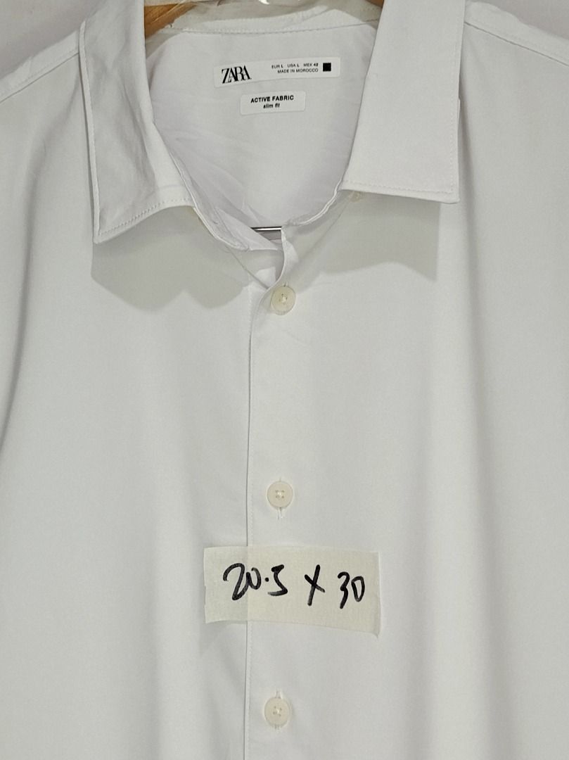 Zara White Active Fabric Slim Fit Shirt (Category: Shirts) located in Balamban. Submitted by pncollectionph (Listing ID 1432119340, Image 2). Description: - Zara white shirt - Size: L - Fit: Slim - Fabric: Active - Features: Classic collar, button-down closure - Made in Morocco - Condition: Good.
