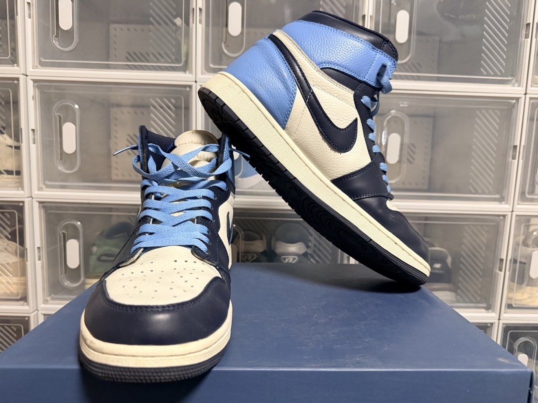 Air Jordan 1 High Obsidian (Category: Sneakers) located in Quezon City. Submitted by 30somethingtreasures (Listing ID 1432253868, Image 3). Description: - Air Jordan 1 High OG - University Blue colorway - White base - Navy blue overlays - Light blue collar - Navy blue soles - Light blue laces - Nike swoosh on sides - Air Jordan wings logo.