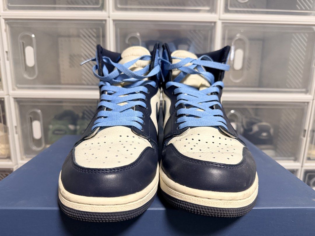 Air Jordan 1 High Obsidian (Category: Sneakers) located in Quezon City. Submitted by 30somethingtreasures (Listing ID 1432253868, Image 2). Description: - Air Jordan 1 High OG - University Blue colorway - White base - Navy blue overlays - Light blue collar - Navy blue soles - Light blue laces - Nike swoosh on sides - Air Jordan wings logo.