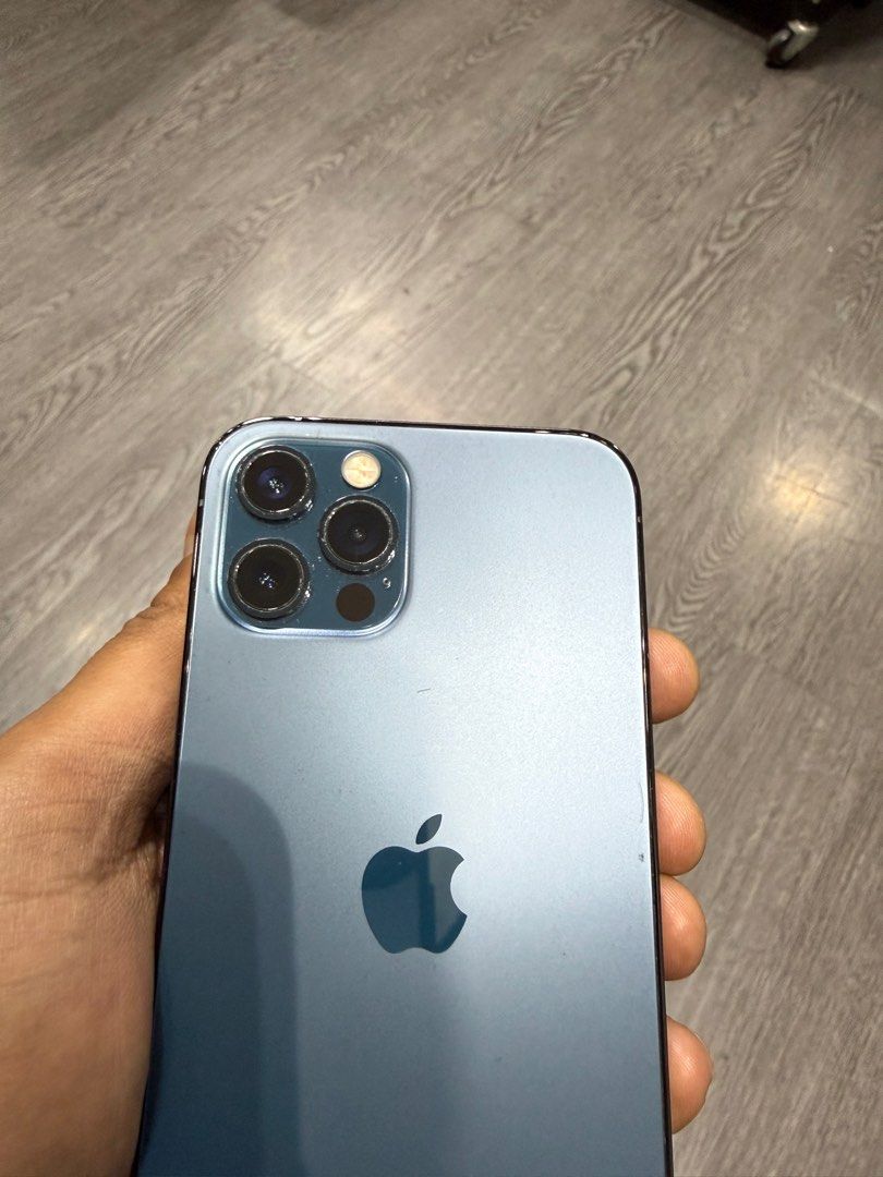 (Category: iPhone 12 Series) located in Singapore. Submitted by dannyspark359 (Listing ID 1432270740, Image 1). Description: - iPhone 12 Pro in Pacific Blue - Fully functional - Phone only with box - Please view photos for condition camera Face ID all working great .