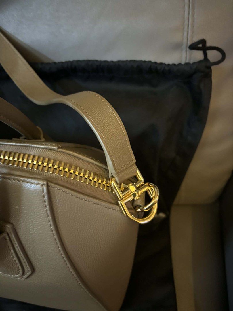 Authentic Givenchy Antigona Medium Natural Beige (Category: Luxury Bags & Wallets) located in Pasig City. Submitted by kazuesan7741 (Listing ID 1432254819, Image 3). Description: This bag is the Givenchy Antigona, a classic luxury handbag known for its structured, trapezoid silhouette and signature triangular logo patch. With orignal Givenchy dust bag also include a detachable shoulder strap, a care booklet, a leather swatch. No issues whatsoever