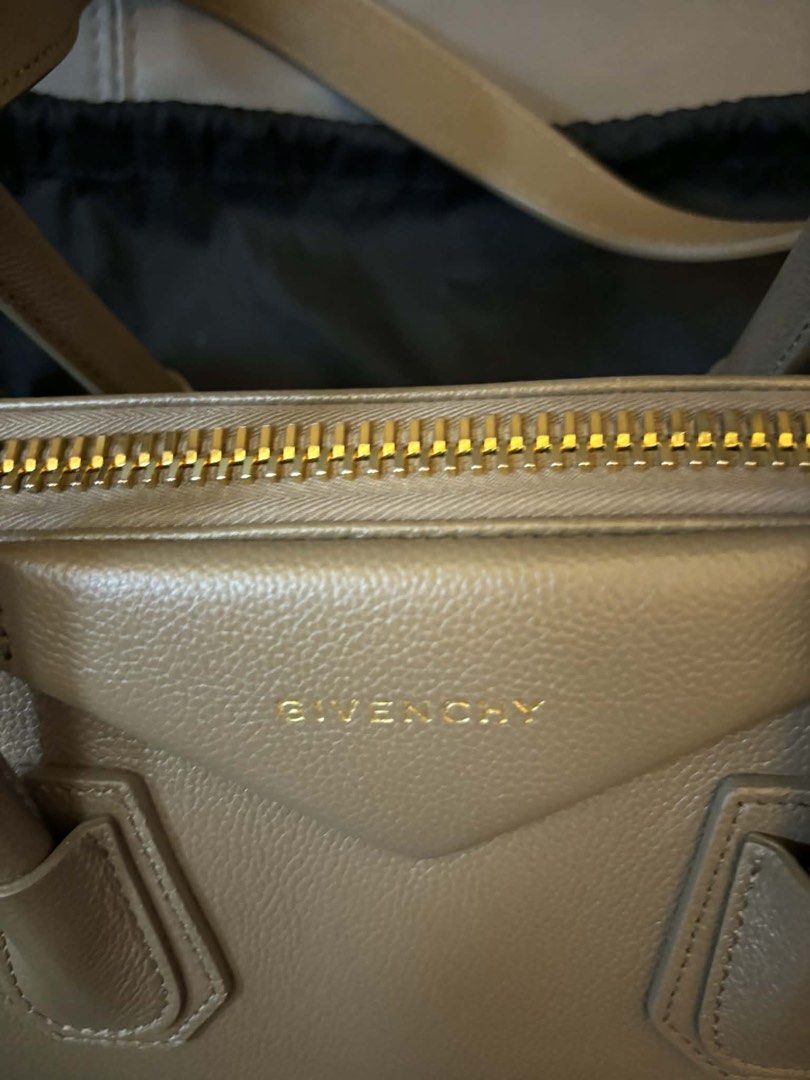 Authentic Givenchy Antigona Medium Natural Beige (Category: Luxury Bags & Wallets) located in Pasig City. Submitted by kazuesan7741 (Listing ID 1432254819, Image 2). Description: This bag is the Givenchy Antigona, a classic luxury handbag known for its structured, trapezoid silhouette and signature triangular logo patch. With orignal Givenchy dust bag also include a detachable shoulder strap, a care booklet, a leather swatch. No issues whatsoever