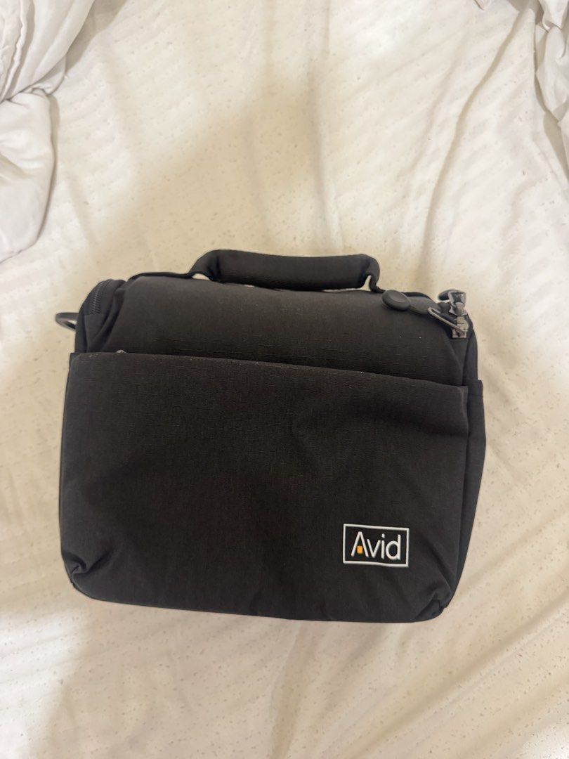 Avid camera bag (Category: Camera Bags & Carriers) located in Makati City. Submitted by airahern (Listing ID 1404739374, Image 1). Description: - Brand new Avid bag - Still in original packaging - Color: Dark grey/black - Shape: Rectangular - Type: Likely a shoulder bag - Sealed in plastic - waterproof - negotiable .