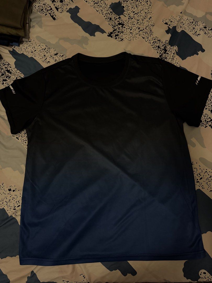 Black and Blue Gradient Dri fit T-shirt (Category: Tshirts & Polo Shirts ) located in Quezon City. Submitted by jofer1028 (Listing ID 1432362092, Image 1). Description: - Black to blue gradient design - Short sleeves - Crew neck - Smooth, athletic fabric - White stripes on sleeves - Perfect for casual wear and workouts 📍Cubao, QC.