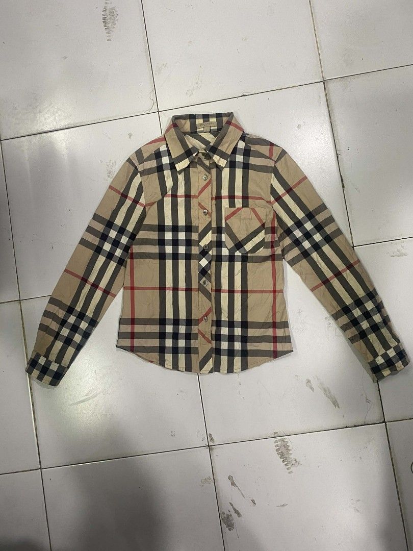 Burberry Brit Checkered Shirt - Large (Category: Tshirts & Polo Shirts ) located in Zamboanga. Submitted by nurjimdigo71795 (Listing ID 1432239143, Image 1). Description: - Burberry Brit checkered shirt - Size: Large - Features a classic plaid pattern - Button-down front - Single chest pocket - Made from a cotton and elastane blend - Long sleeves - Collared neckline - Machine washable.