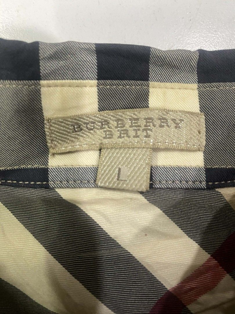 Burberry Brit Checkered Shirt - Large (Category: Tshirts & Polo Shirts ) located in Zamboanga. Submitted by nurjimdigo71795 (Listing ID 1432239143, Image 2). Description: - Burberry Brit checkered shirt - Size: Large - Features a classic plaid pattern - Button-down front - Single chest pocket - Made from a cotton and elastane blend - Long sleeves - Collared neckline - Machine washable.