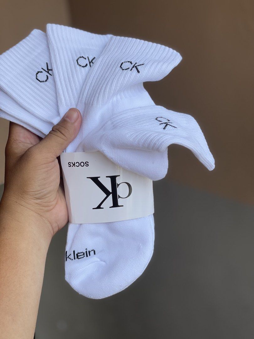 Calvin Klein White Socks (Category: Socks) located in Manila. Submitted by vensen1798495 (Listing ID 1432216350, Image 3). Description: - Brand new white Calvin Klein socks. - Features the iconic "CK" logo embroidered on the cuff. - Comes in original clear plastic packaging. - Made in China. - Material: 98% polyester, 2% spandex. 1bundle 3pairs 200 Pesos Tondo manila.