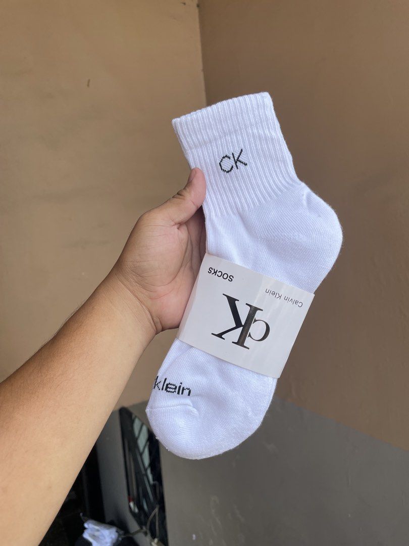 Calvin Klein White Socks (Category: Socks) located in Manila. Submitted by vensen1798495 (Listing ID 1432216350, Image 2). Description: - Brand new white Calvin Klein socks. - Features the iconic "CK" logo embroidered on the cuff. - Comes in original clear plastic packaging. - Made in China. - Material: 98% polyester, 2% spandex. 1bundle 3pairs 200 Pesos Tondo manila.