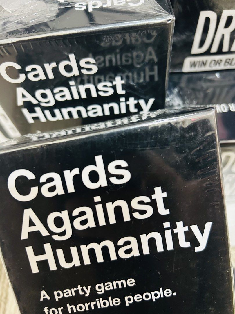 Cards Against Humanity, Scrabble, Risk It, Uno (Category: Board Games & Puzzles) located in Quezon City. Submitted by playboxph (Listing ID 1432209807, Image 1). Description: Various board games available. Includes Cards Against Humanity, Scrabble, Risk It or Drink It, Uno, and more. Some games are designed for adults, while others are suitable for families. Perfect for game nights and gatherings. All games appear to be sealed and ready to play..