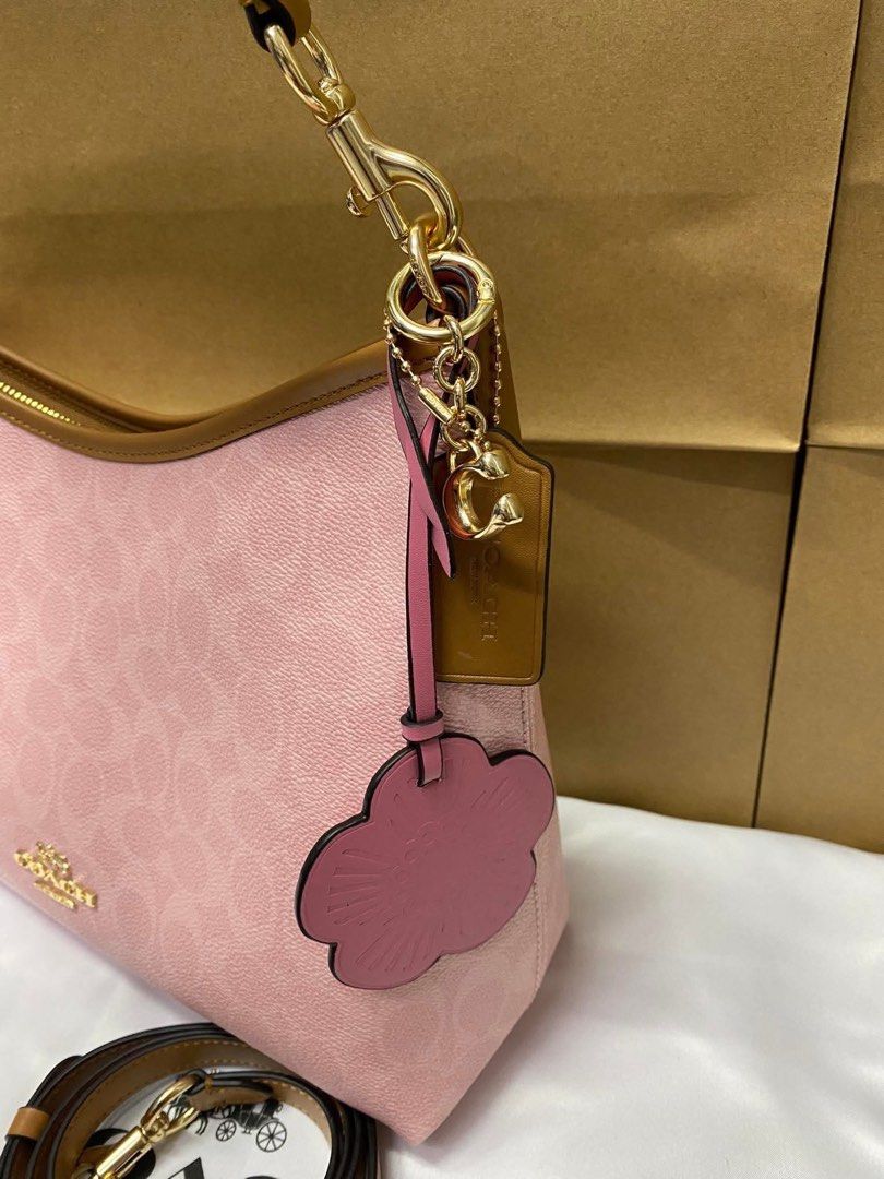 Coach Laurel with Charms (Category: Luxury Bags & Wallets) located in Bulacan. Submitted by mykakarizza (Listing ID 1432298838, Image 3). Description: HALA SUPER CUTE!! ₱2000 only Laurel with charms Complete inclusions paperbag + dustbag + cards 📸 Actual pics! 🙋🏻‍♀️.