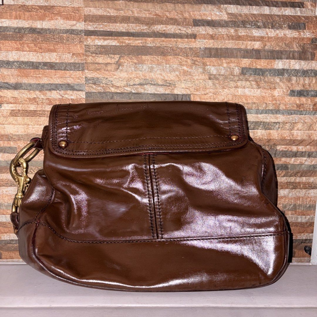 Coach Legacy Ali in Brown (Project Bag) (Category: Luxury Bags & Wallets) located in Manila. Submitted by skzfan69 (Listing ID 1432376931, Image 2). Description: This is an authentic Coach legacy Ali bag, originally in the color raspberry red. Original leather came with patina, scratches, and mold measle scarring that can't be remedied with typical leather conditioning items. Recolored the bag para matakpan yung scarring + other flaws. Used Angel