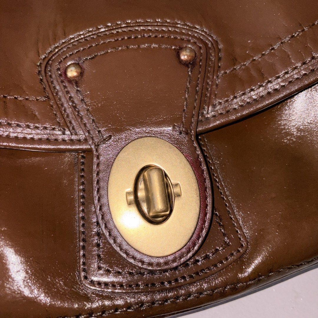 Coach Legacy Ali in Brown (Project Bag) (Category: Luxury Bags & Wallets) located in Manila. Submitted by skzfan69 (Listing ID 1432376931, Image 3). Description: This is an authentic Coach legacy Ali bag, originally in the color raspberry red. Original leather came with patina, scratches, and mold measle scarring that can't be remedied with typical leather conditioning items. Recolored the bag para matakpan yung scarring + other flaws. Used Angel