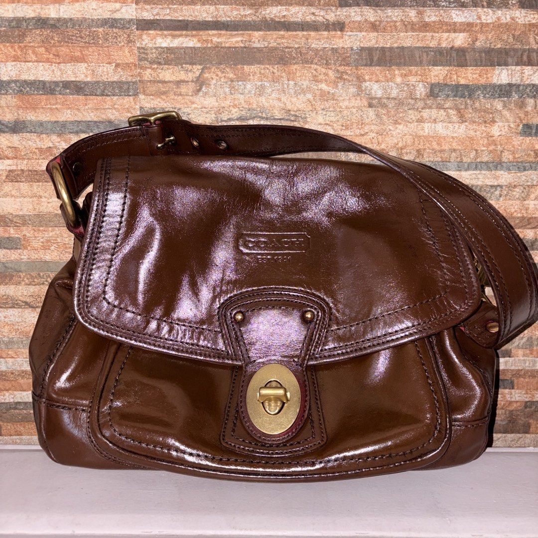 Coach Legacy Ali in Brown (Project Bag) (Category: Luxury Bags & Wallets) located in Manila. Submitted by skzfan69 (Listing ID 1432376931, Image 1). Description: This is an authentic Coach legacy Ali bag, originally in the color raspberry red. Original leather came with patina, scratches, and mold measle scarring that can't be remedied with typical leather conditioning items. Recolored the bag para matakpan yung scarring + other flaws. Used Angel