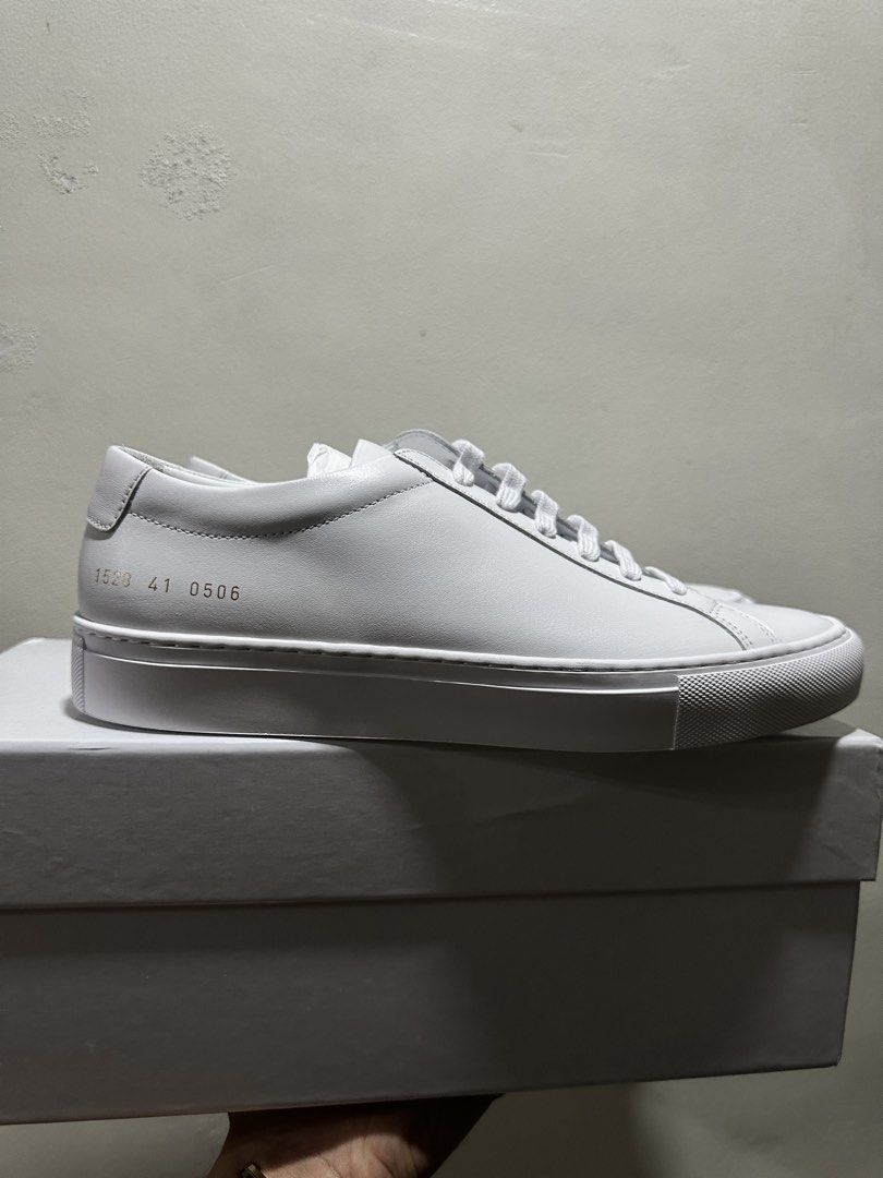 Common Projects Achilles Low White • for pre order (Category: Sneakers) located in Manila. Submitted by levelup0 (Listing ID 1432301679, Image 1). Description: - Common Projects Achilles Low - Color: White - Size: 41 - Includes original box and dust bag - Model number: 1528 41 0506 - Features white laces.