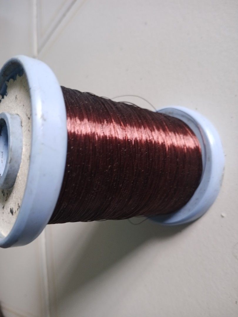 Copper Wire Thread Spool (Category: Craft Supplies & Tools) located in Singapore. Submitted by beyondkeys07986 (Listing ID 1432223591, Image 5). Description: - Used copper wire spool - Blue spool color - Dark brown wire - Suitable for crafts and DIY projects - Some wear and tear present.