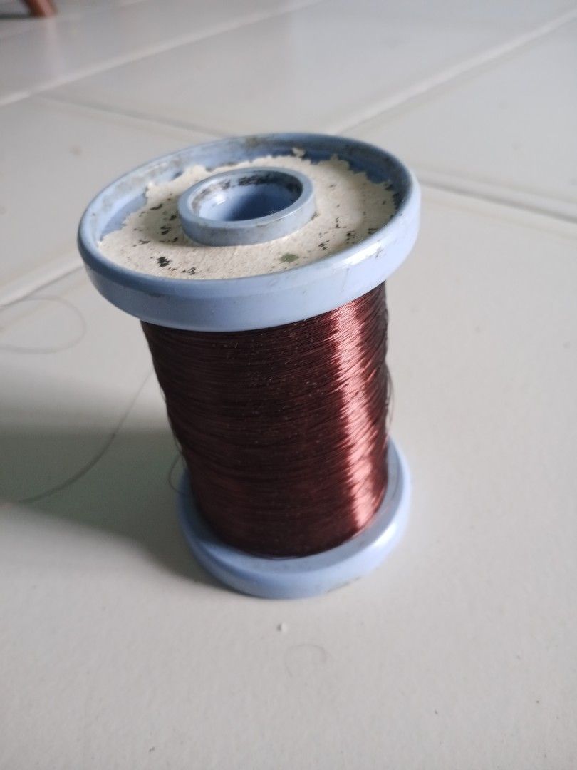 Copper Wire Thread Spool (Category: Craft Supplies & Tools) located in Singapore. Submitted by beyondkeys07986 (Listing ID 1432223591, Image 2). Description: - Used copper wire spool - Blue spool color - Dark brown wire - Suitable for crafts and DIY projects - Some wear and tear present.