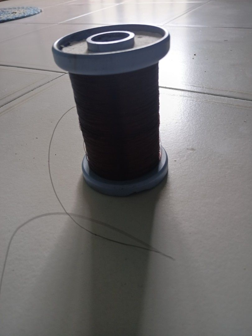 Copper Wire Thread Spool (Category: Craft Supplies & Tools) located in Singapore. Submitted by beyondkeys07986 (Listing ID 1432223591, Image 4). Description: - Used copper wire spool - Blue spool color - Dark brown wire - Suitable for crafts and DIY projects - Some wear and tear present.