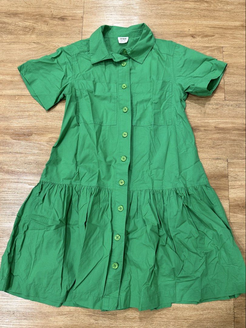 Cotton On Green Dress (Category: Dresses) located in Taguig. Submitted by fromtcloset (Listing ID 1432292545, Image 1). Description: - Cotton On green dress - Size: XXS-XS - Features: - Collared neckline - Button-down front - Short sleeves - Two chest pockets - Tiered skirt - Made in India.