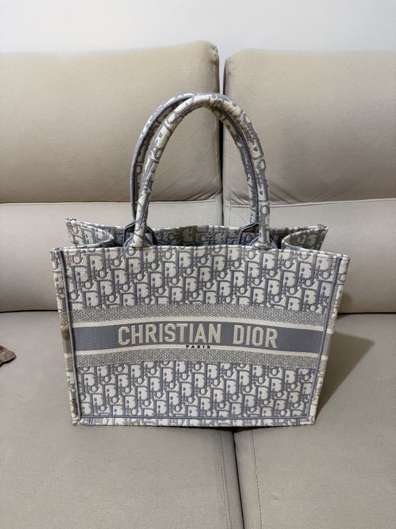 Dior Book Tote (Gray Oblique in Medium) (Category: Luxury Bags & Wallets) located in Mandaluyong City. Submitted by czegarcia (Listing ID 1432219303, Image 1). Description: - With dust bag, authenticity card, box and receipt. Bought this in July 2023 at Greenbelt, Makati. There are minor flaws (pls see photos, or message me for more detailed photos) RFS: I don’t find myself reaching for it anymore. It’s just in my closet for months now. .