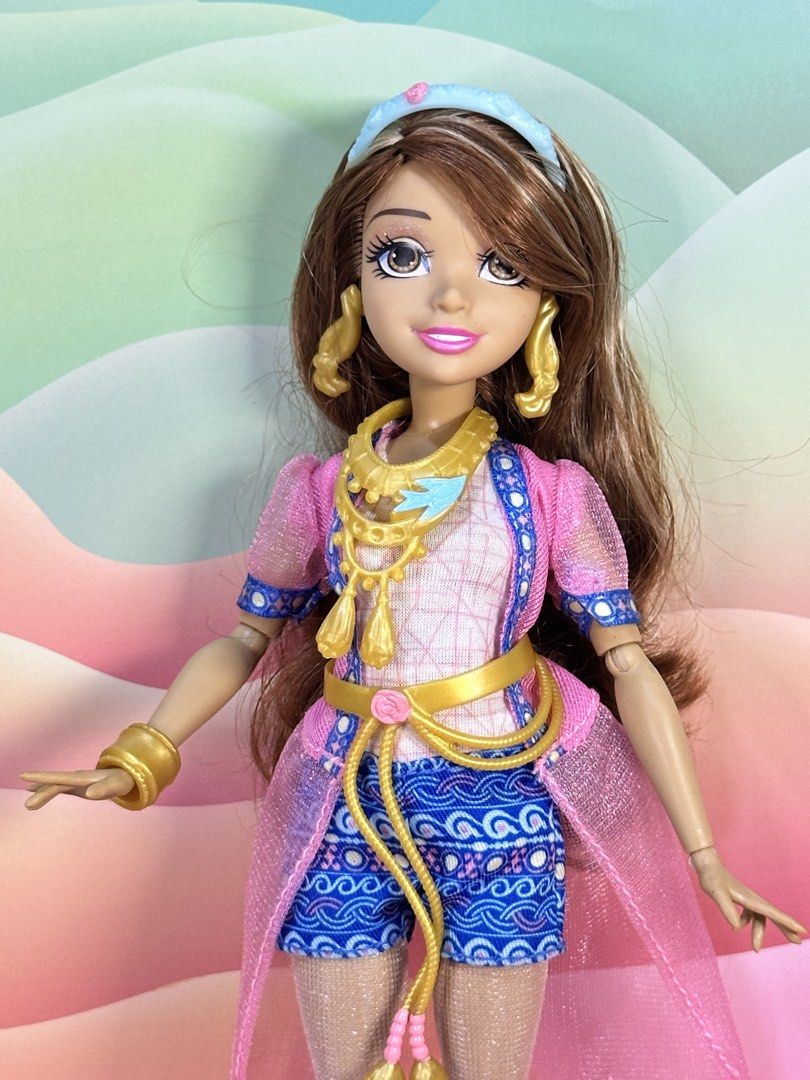 Disney Descendants Audrey Genie Chic Doll (Category: Kids Toys) located in Cebu City. Submitted by danzysdaintydollies (Listing ID 1432331309, Image 2). Description: - Long brown hair with blonde highlights - Pink and blue outfit - Gold accessories (earrings, bracelet, necklace) - Blue shoes - Matching headband - Pink sheer overcoat - Blue patterned shorts.