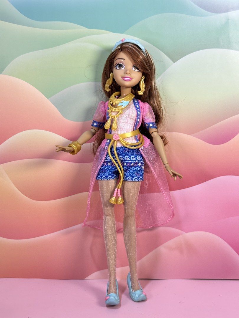 Disney Descendants Audrey Genie Chic Doll (Category: Kids Toys) located in Cebu City. Submitted by danzysdaintydollies (Listing ID 1432331309, Image 1). Description: - Long brown hair with blonde highlights - Pink and blue outfit - Gold accessories (earrings, bracelet, necklace) - Blue shoes - Matching headband - Pink sheer overcoat - Blue patterned shorts.