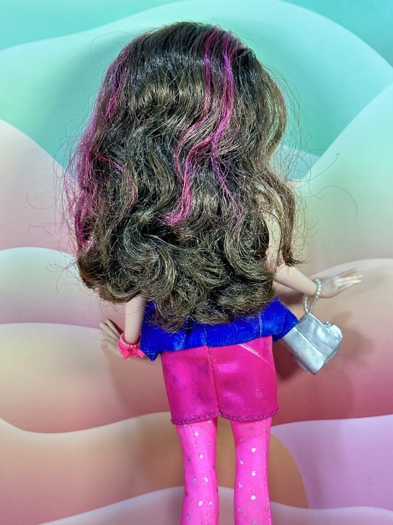 Disney Descendants Jane Neon Lights Doll (Category: Kids Toys) located in Cebu City. Submitted by danzysdaintydollies (Listing ID 1432331500, Image 3). Description: - Stylish fashion doll - Blue and pink dress - Pink tights and silver shoes - Long, wavy hair with pink highlights - Pink glasses and earrings - Silver purse and pink bracelet - Red lipstick.