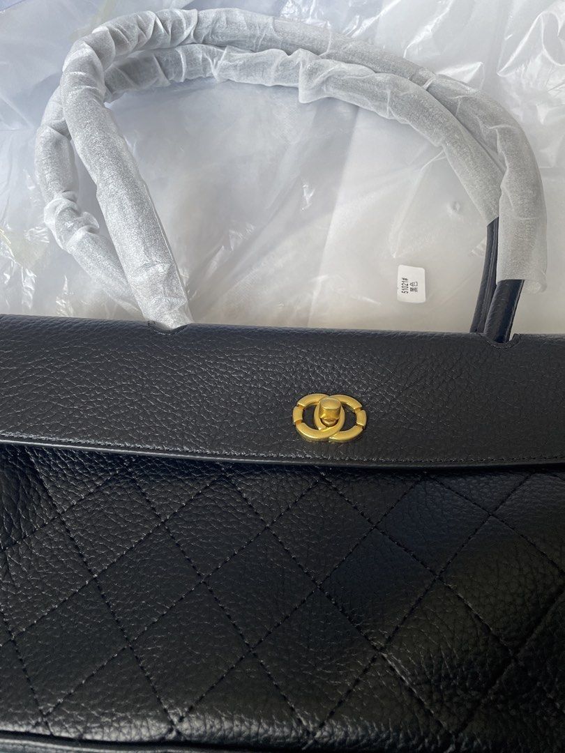 Drawstring bag (Category: Shoulder Bags) located in Singapore. Submitted by Jassslin72 (Listing ID 1428894669, Image 4). Description: Like new milk tea colour drawstring bag. A little chip on the side logo. Black shoulder bag is brand new and selling at $88.