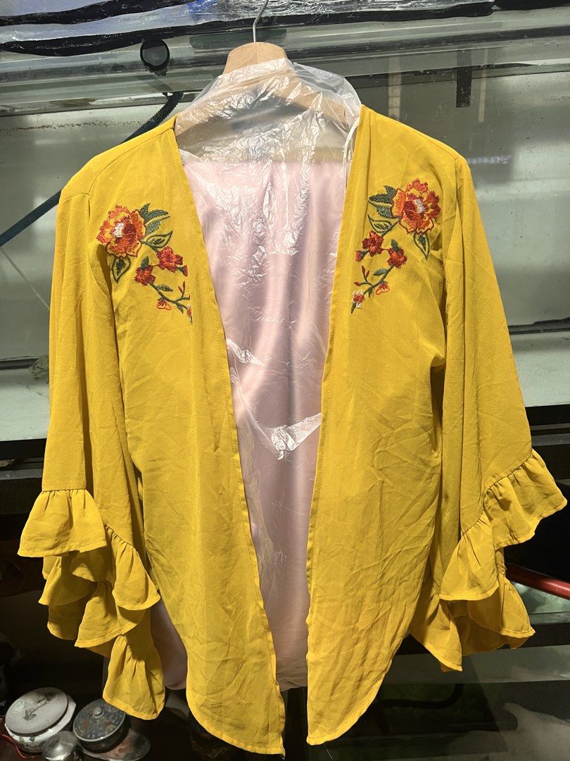 Forever 21 Embroidered Ruffle Sleeve Blouse (Category: Blouses) located in Quezon City. Submitted by fly29 (Listing ID 1432283483, Image 1). Description: - Forever 21 blouse - Vibrant yellow color - Floral embroidery - Ruffle sleeves - Lightweight design - Size: S - Perfect for adding a pop of color!.