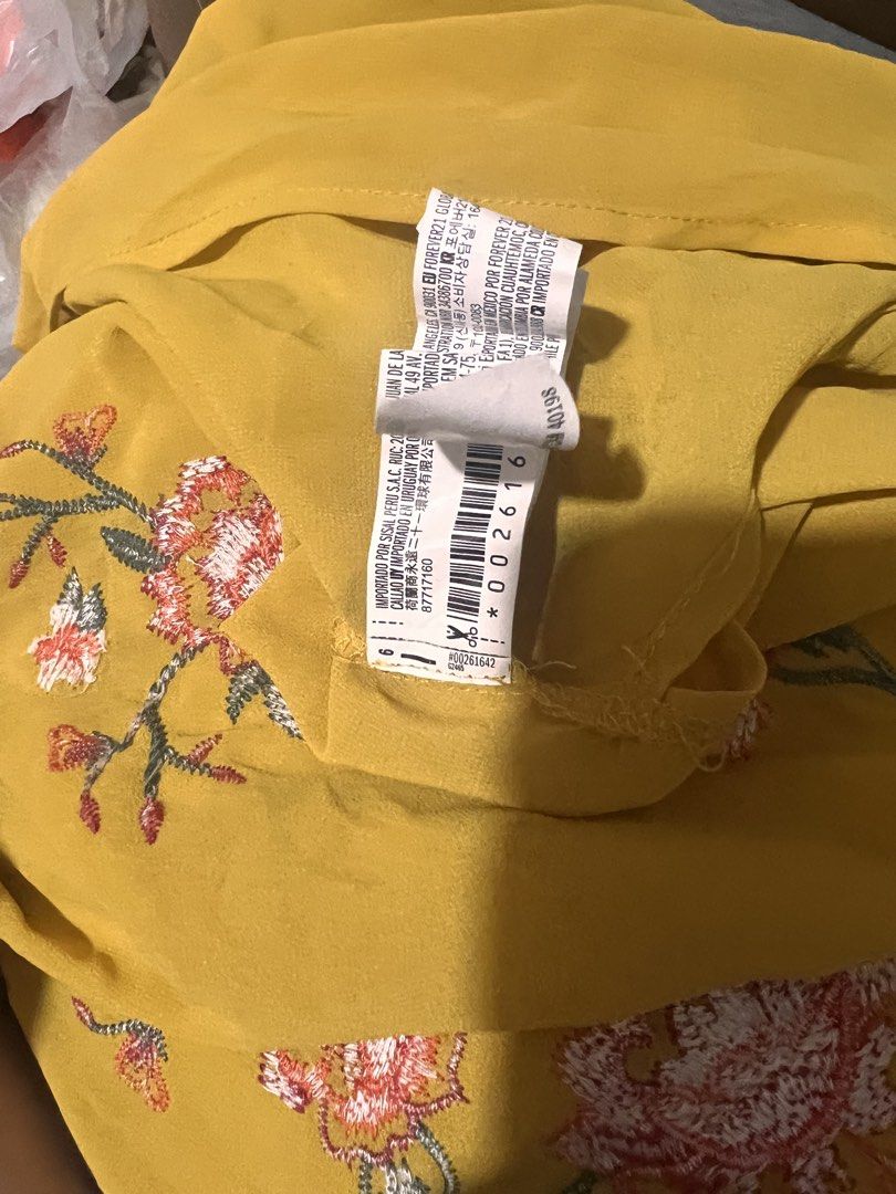 Forever 21 Embroidered Ruffle Sleeve Blouse (Category: Blouses) located in Quezon City. Submitted by fly29 (Listing ID 1432283483, Image 3). Description: - Forever 21 blouse - Vibrant yellow color - Floral embroidery - Ruffle sleeves - Lightweight design - Size: S - Perfect for adding a pop of color!.
