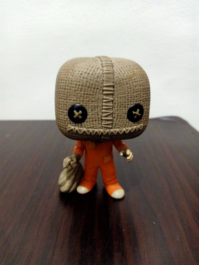 Funko Pop! Sam Trick 'r Treat Figure (Category: Designer & Blind Box Toys) located in Las Pinas. Submitted by the_recycle_shop (Listing ID 1432330099, Image 1). Description: - Funko Pop! figure of Sam from Trick 'r Treat. - Features: Burlap sack head, orange jumpsuit, and holding a sack. - Condition: Good - Details: Funko LLC 2022 stamp on feet. Made in Vietnam..