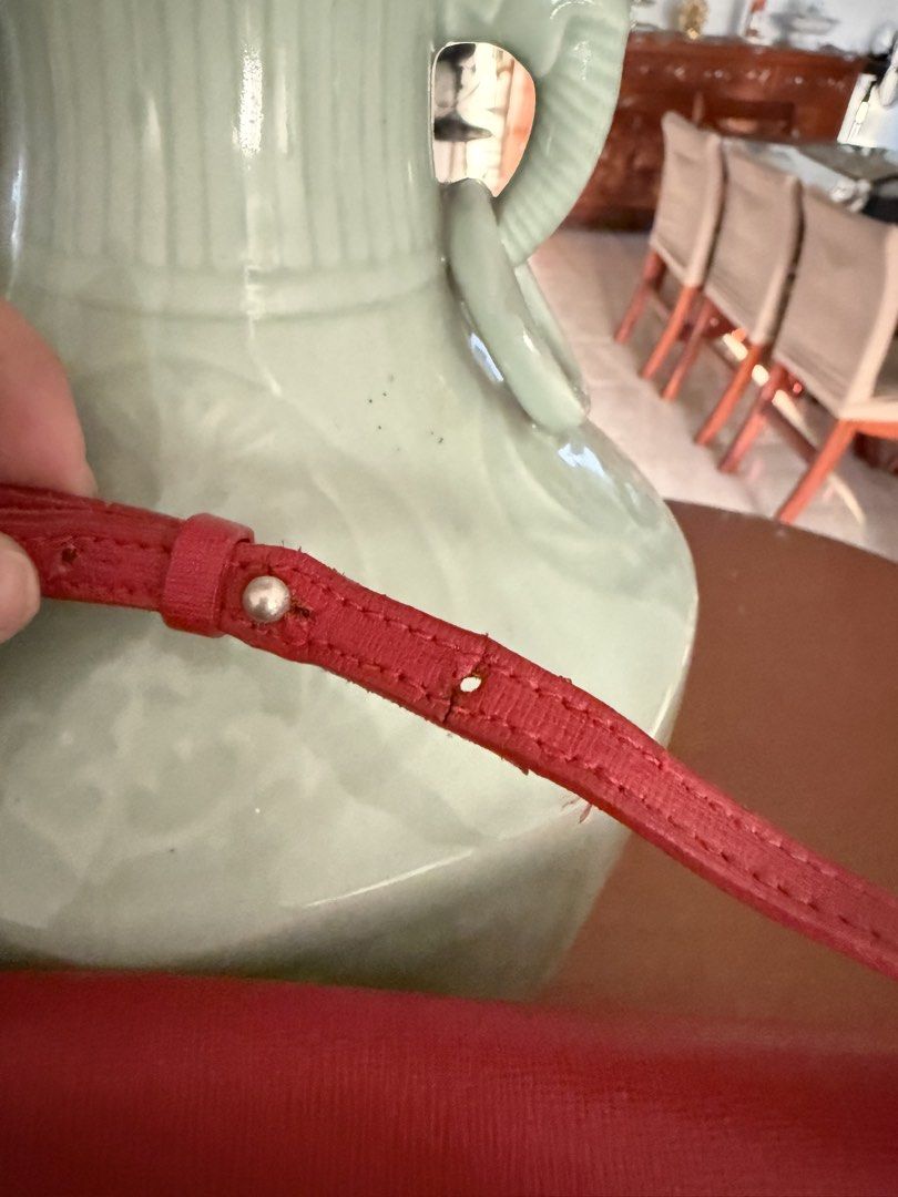 Furla Red Crossbody Bag (Category: Luxury Bags & Wallets) located in Quezon City. Submitted by myfavecloset11 (Listing ID 1432288591, Image 3). Description: - Red Furla crossbody bag - Flap closure with magnetic snap - Interior zippered pocket - Furla branded tag - Long, adjustable strap - w/ signs of wear on strap.