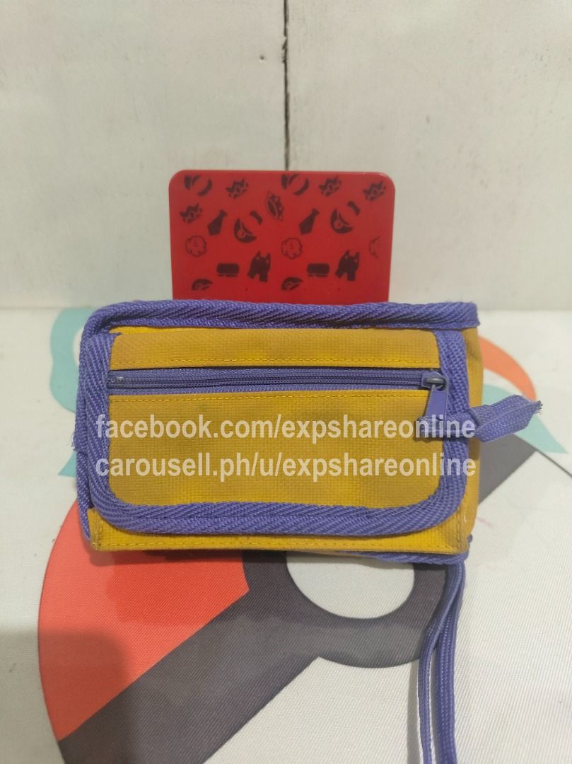 Gameboy Pokemon - Pikachu Pouch (Category: Cases & Covers) located in Cebu City. Submitted by expshareonline (Listing ID 1432390018, Image 2). Description: - Gameboy Pokemon Pikachu Pouch - Features Pikachu and "Gotta catch 'em all!" - Yellow and purple color scheme - Designed for Gameboy or small items.