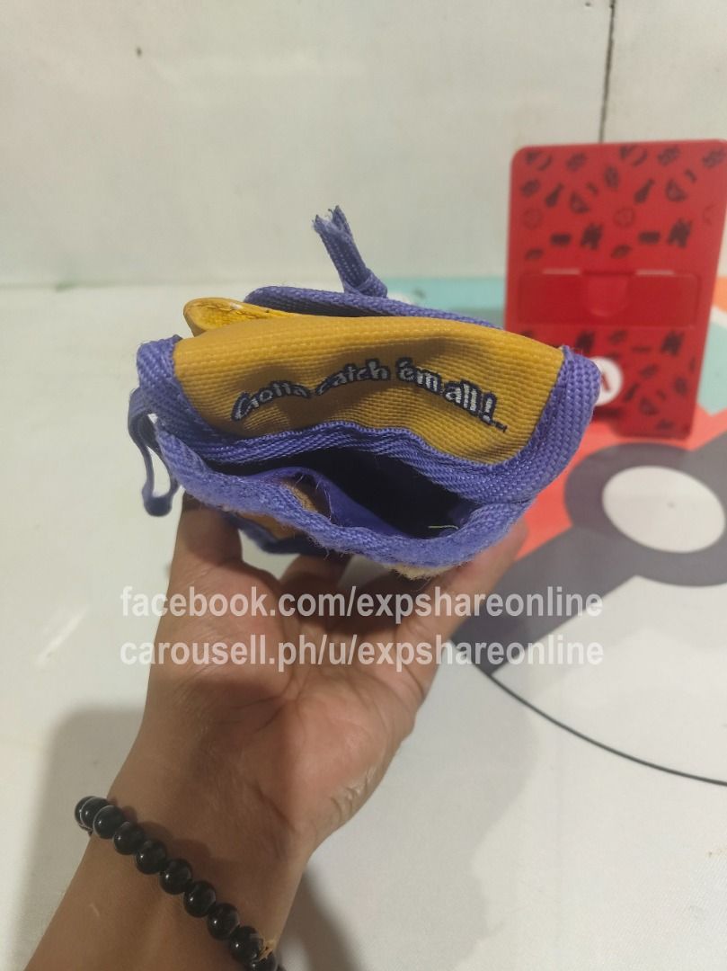 Gameboy Pokemon - Pikachu Pouch (Category: Cases & Covers) located in Cebu City. Submitted by expshareonline (Listing ID 1432390018, Image 3). Description: - Gameboy Pokemon Pikachu Pouch - Features Pikachu and "Gotta catch 'em all!" - Yellow and purple color scheme - Designed for Gameboy or small items.