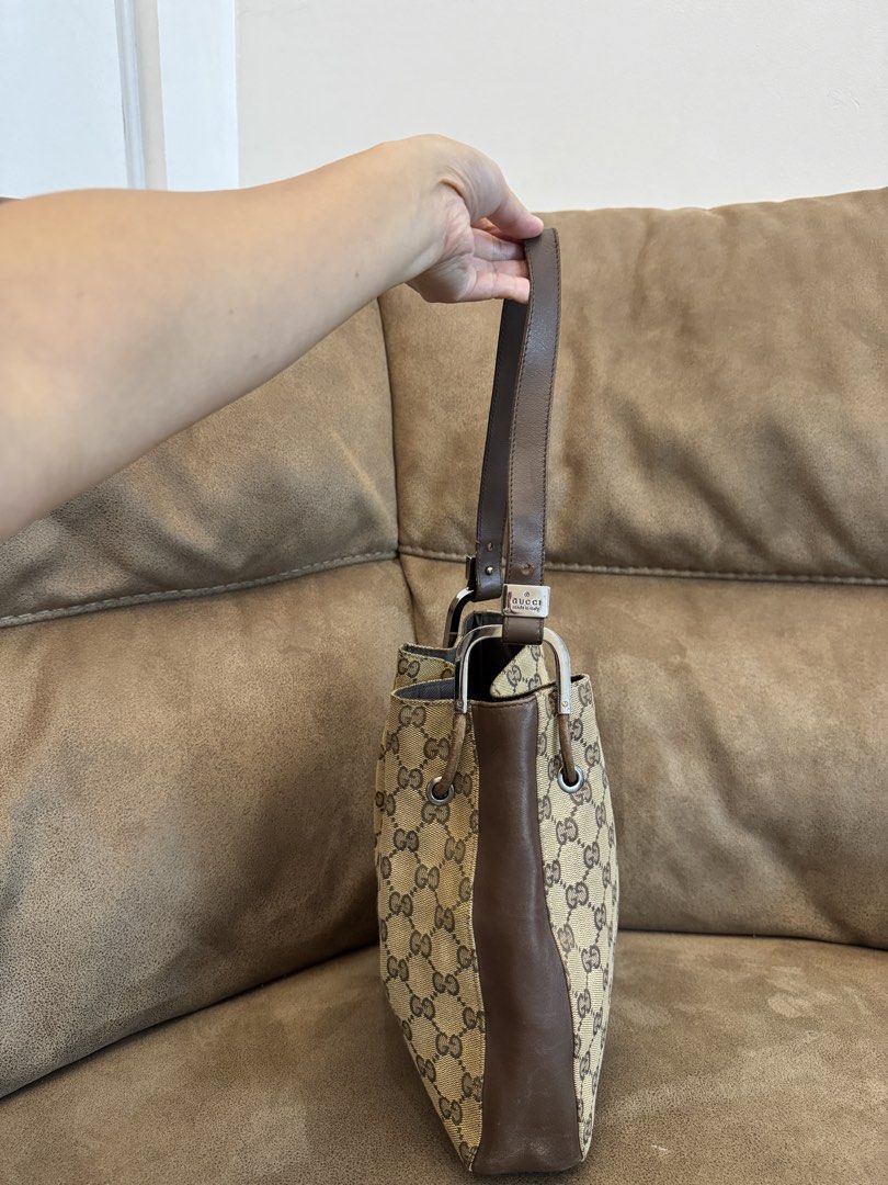 Gucci GG Canvas Bucket Bag (Category: Luxury Bags & Wallets) located in Manila. Submitted by mayserrano16 (Listing ID 1432374074, Image 3). Description: - Authentic Gucci bucket bag - Iconic GG canvas - Brown leather trim - Drawstring closure - Single handle - Fabric-lined interior - Interior zip pocket - Gucci logo visible - Made in Italy.