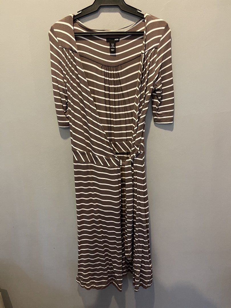 H&M Striped Dress (Category: Dresses) located in Muntinlupa City. Submitted by cheeeeky (Listing ID 1432285344, Image 1). Description: - H&M midi wrap around dress - Brown and white striped pattern - Square neckline - Three-quarter sleeves - Wrap style design - Tie detail at waist - Midi length.