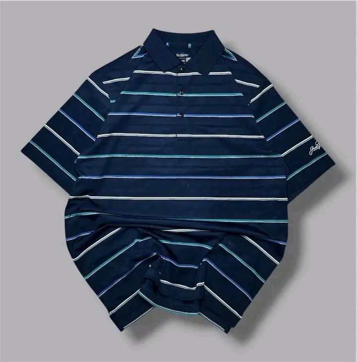 Jack Nicklaus Polo Shirt - Navy Blue (Category: Tshirts & Polo Shirts ) located in Cavite. Submitted by thriftnired (Listing ID 1432309319, Image 1). Description: - Jack Nicklaus Performance polo shirt - Color: Navy blue with horizontal stripes - Features a collared neckline and short sleeves - Jack Nicklaus logo embroidered on the sleeve - Material: 100% polyester - Size: L.