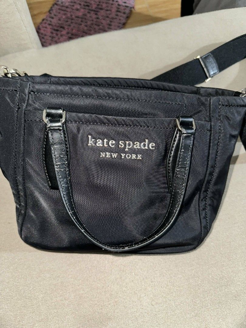 Kate Spade Crossbody Bag (Category: Luxury Bags & Wallets) located in Cavite. Submitted by premfinds (Listing ID 1432362874, Image 1). Description: orig KS Flaw sa handle leather part but over all nylon body in good condition.