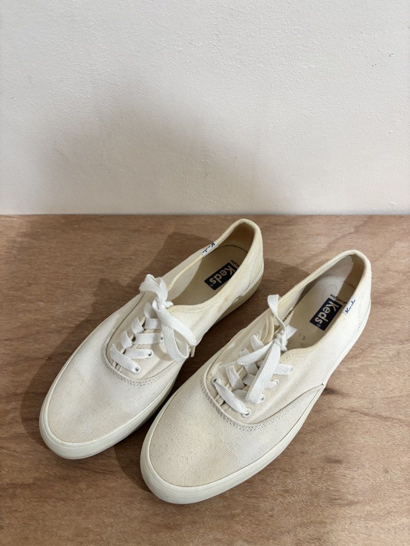 Keds White Canvas Sneakers (Category: Sneakers) located in Bacoor. Submitted by palmroot (Listing ID 1432246908, Image 1). Description: - White Keds canvas sneakers - Size: 7.5 US - Pre-owned condition, natural canvas discoloration - Well-kept and used carefully .