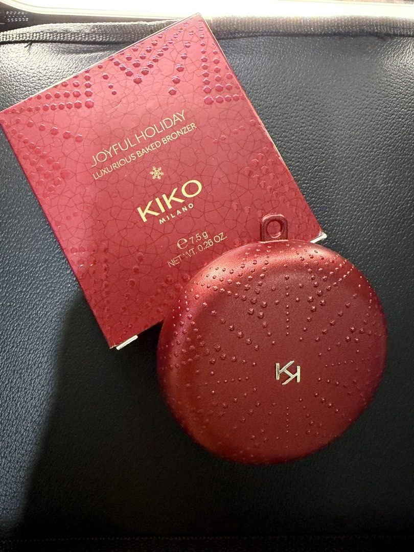 Kiko Milano Joyful Holiday Baked Bronzer (Category: Makeup) located in Manila. Submitted by gracea046 (Listing ID 1432232979, Image 1). Description: Kiko Milano Joyful Holiday Luxurious Baked Bronzer - Swatched only - RFS: Too light for my skintone More description: - Golden-brown shade for a radiant look - Elegant red compact with mirror - Textured, festive packaging - Net weight: 7.5g / 0.26 oz.