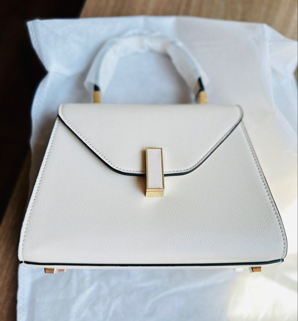 Leather Top Handle Bag (Category: Luxury Bags & Wallets) located in Manila. Submitted by cyecloset (Listing ID 1432225247, Image 1). Description: - Structured top handle bag - Flap closure with gold-tone accent - Detachable shoulder strap - Minimalist design - Suitable for casual and formal occasions.