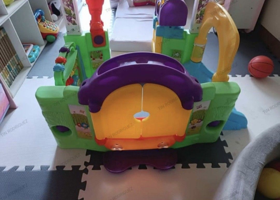 Little Tikes Playhouse (Category: Infant Playtime) located in Manila. Submitted by declutterbabythings (Listing ID 1432198251, Image 3). Description: Little Tikes playhouse features a slide, mailbox, and various interactive elements. It has a colorful design with a door, windows, and a telescope. The playhouse is designed for young children and provides a fun and engaging play environment..