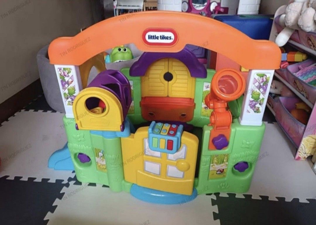 Little Tikes Playhouse (Category: Infant Playtime) located in Manila. Submitted by declutterbabythings (Listing ID 1432198251, Image 1). Description: Little Tikes playhouse features a slide, mailbox, and various interactive elements. It has a colorful design with a door, windows, and a telescope. The playhouse is designed for young children and provides a fun and engaging play environment..